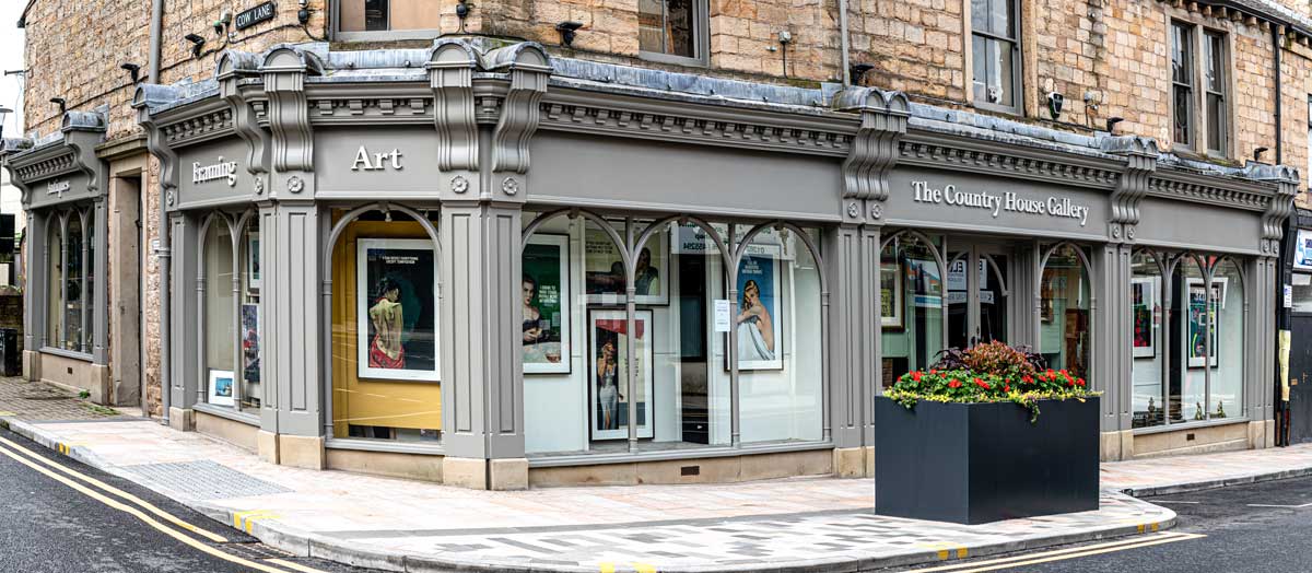 Decorative photo of improvements on shop front with a grey exterior on a sunny day. 